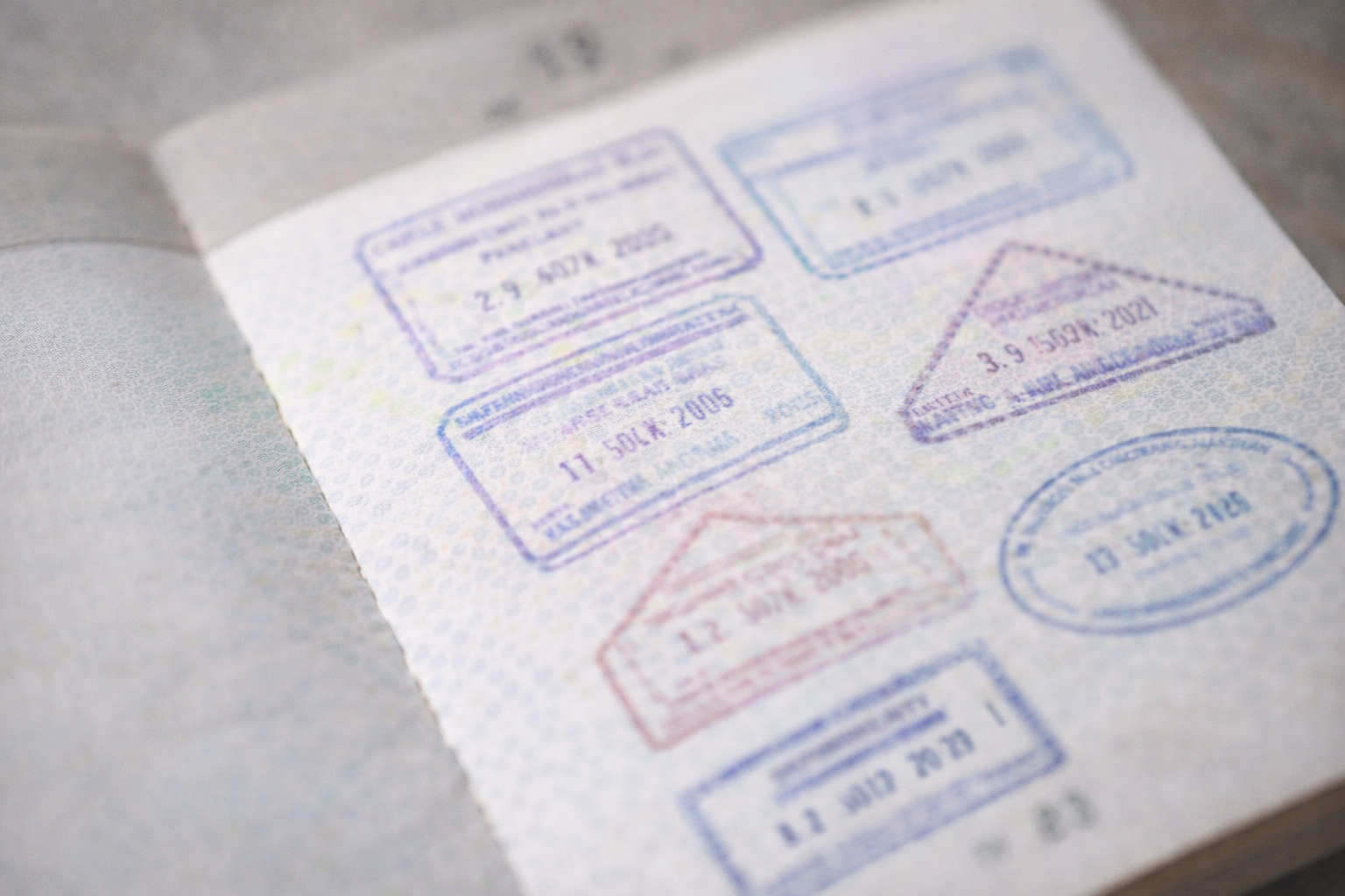 Passport + stamp vibe (no readable stamp)